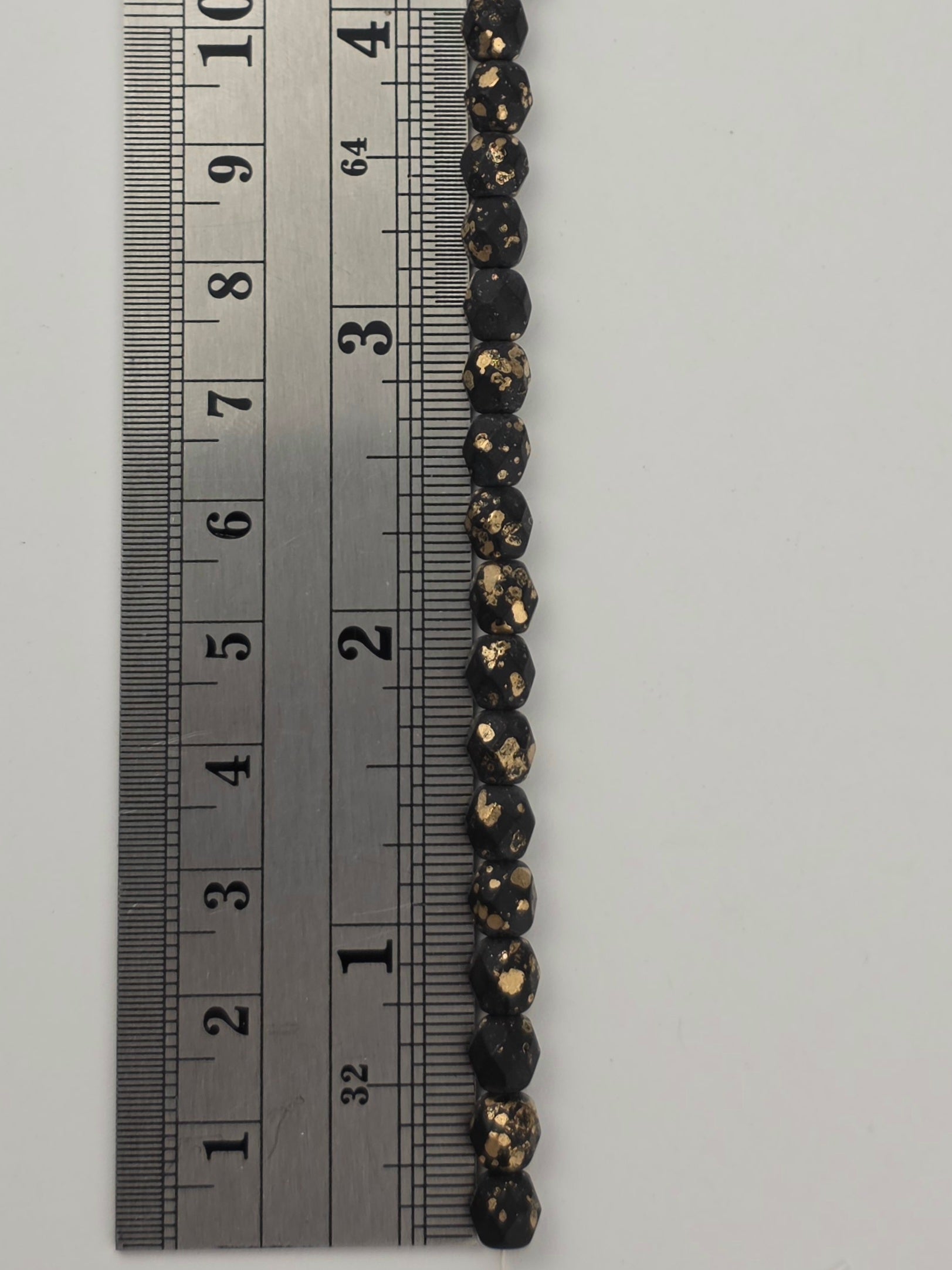 6mm - Black Matte Gold Speckle - Fire Polished