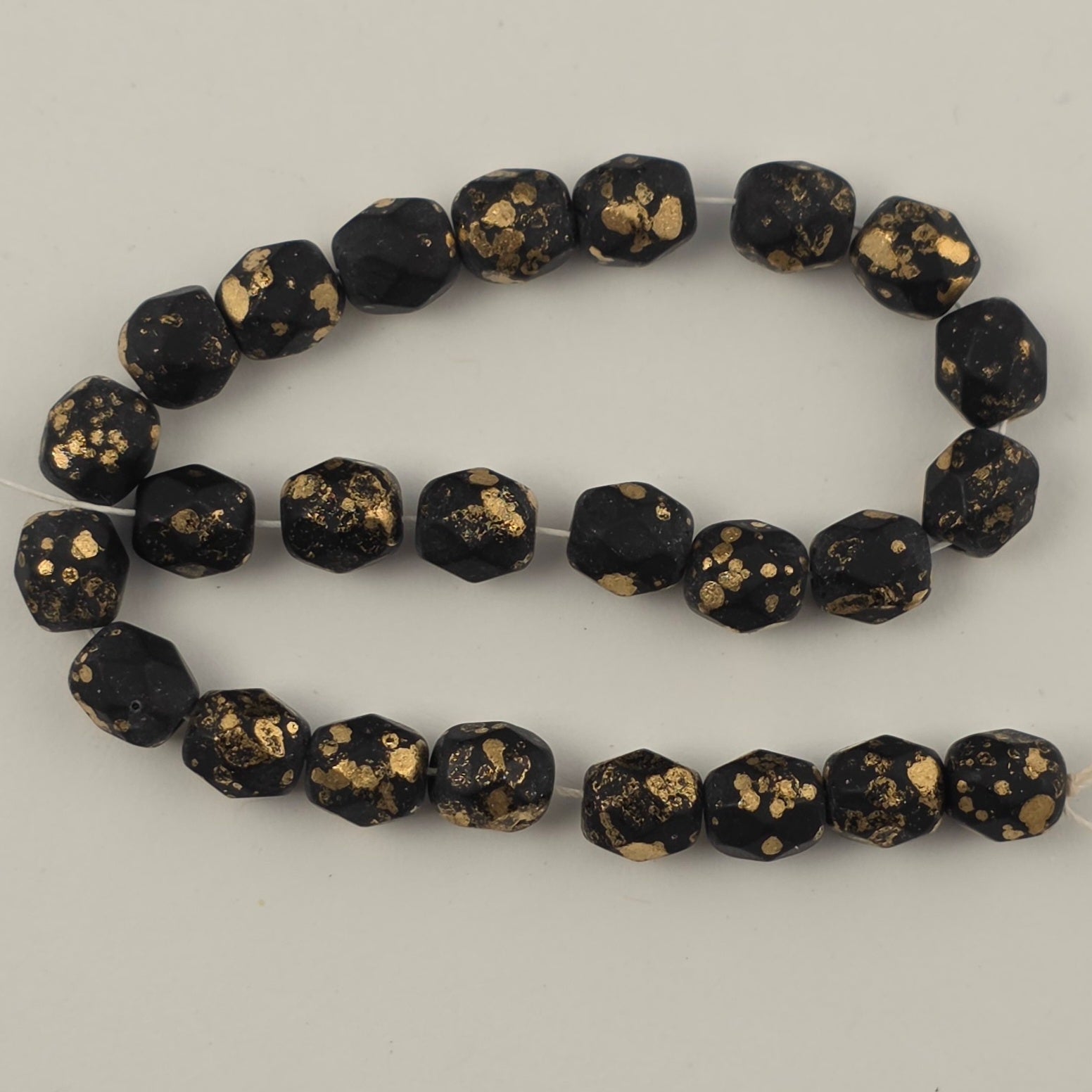 6mm - Black Matte Gold Speckle - Fire Polished