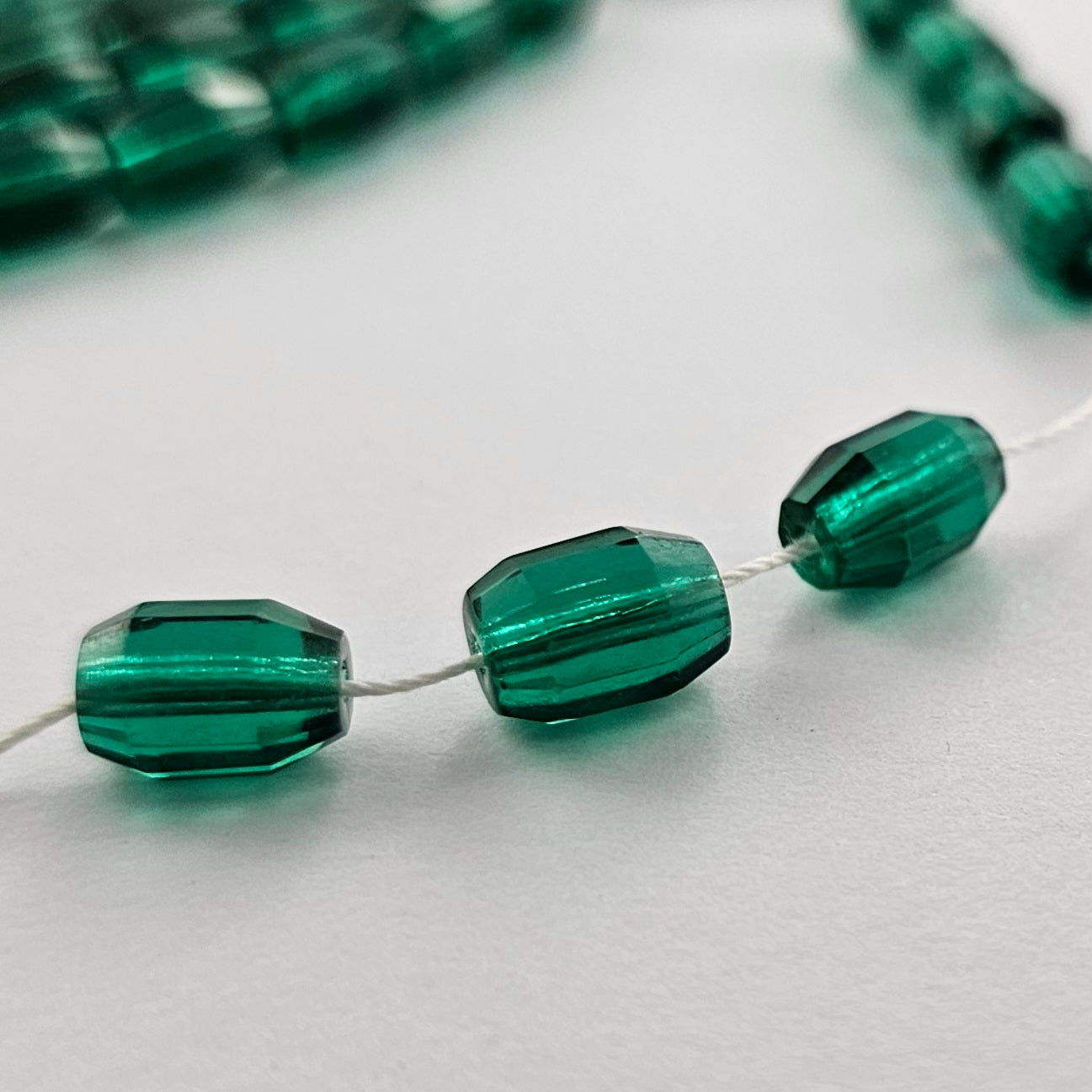 10x7mm Emerald Oval Barrels Fire Polished Czech Glass