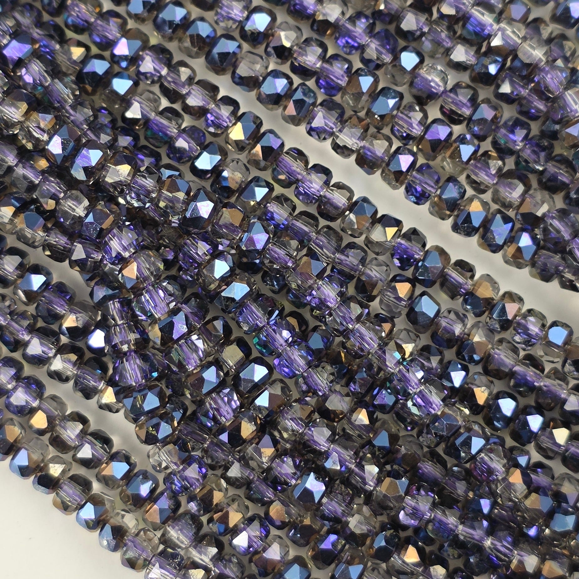 3x4mm - New Cut Crystal Rondelles - Black Diamond with Purple Luster