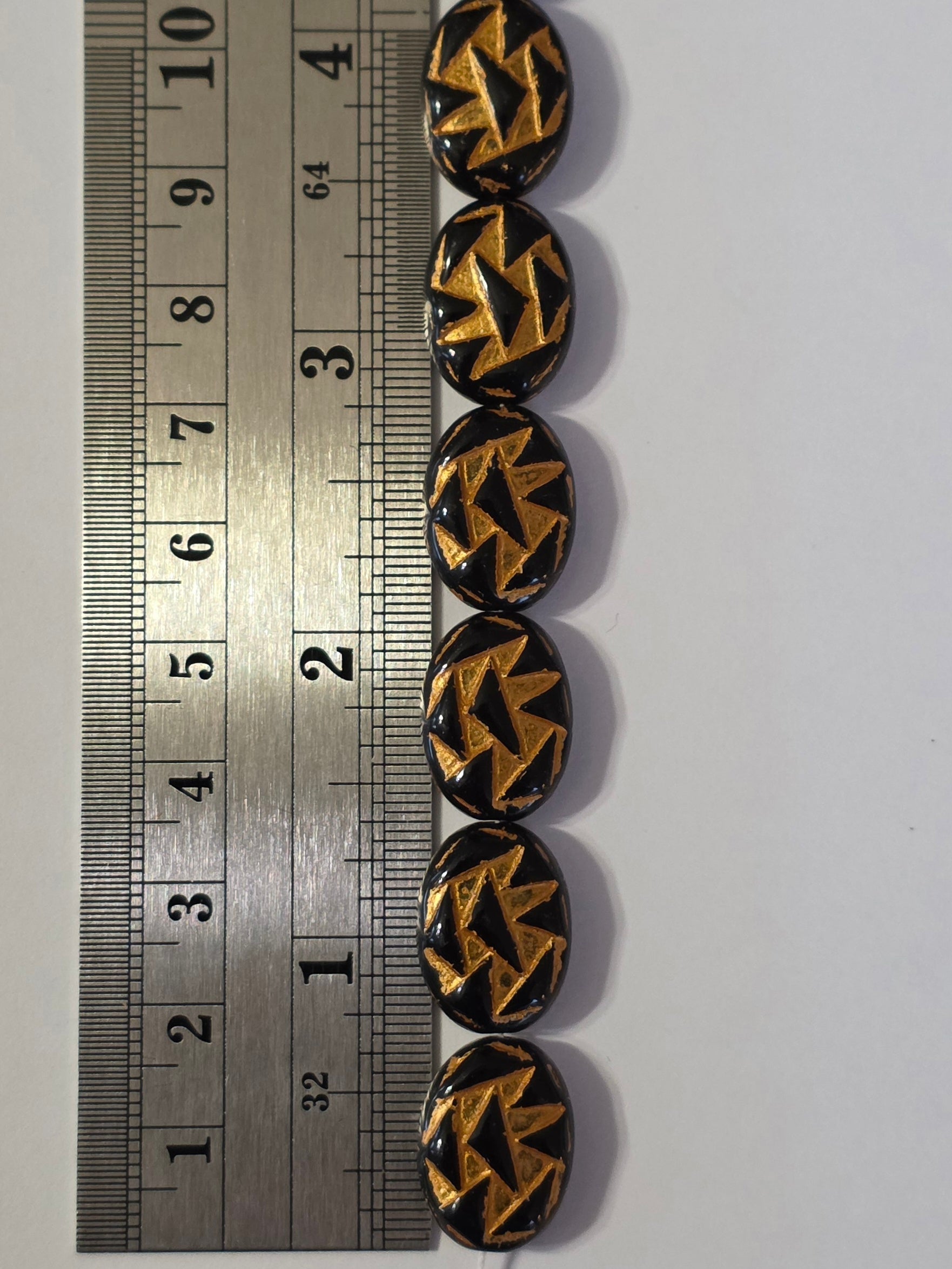 17x13mm Black and Gold Ovals with Triangle Pattern - 12 Beads