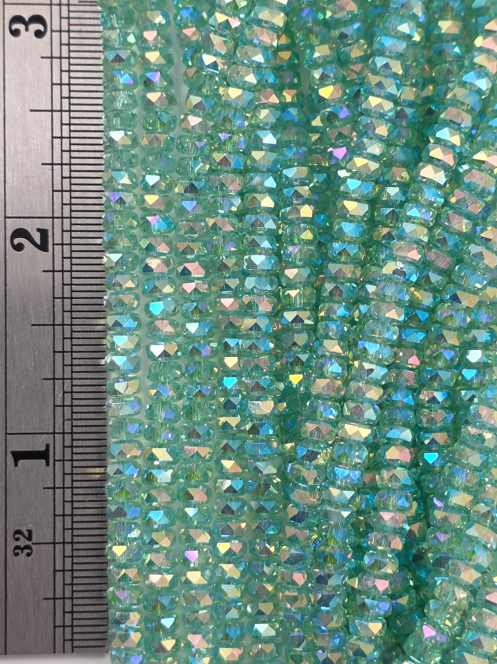 3x4mm - New Cut Crystal Rondelles - Pale Green AB