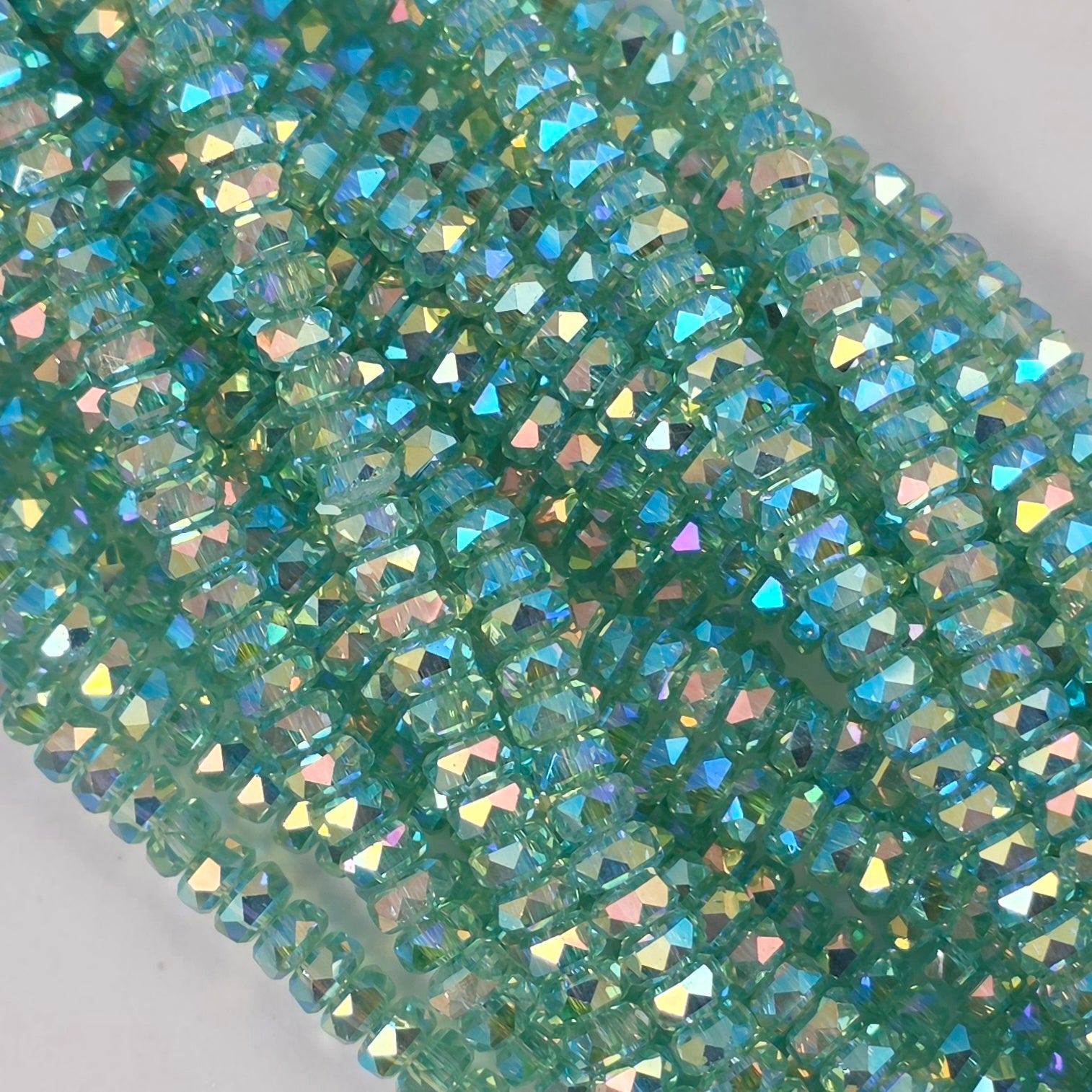 3x4mm - New Cut Crystal Rondelles - Pale Green AB