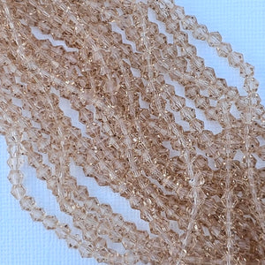 4mm Bicone - Champagne Transparent