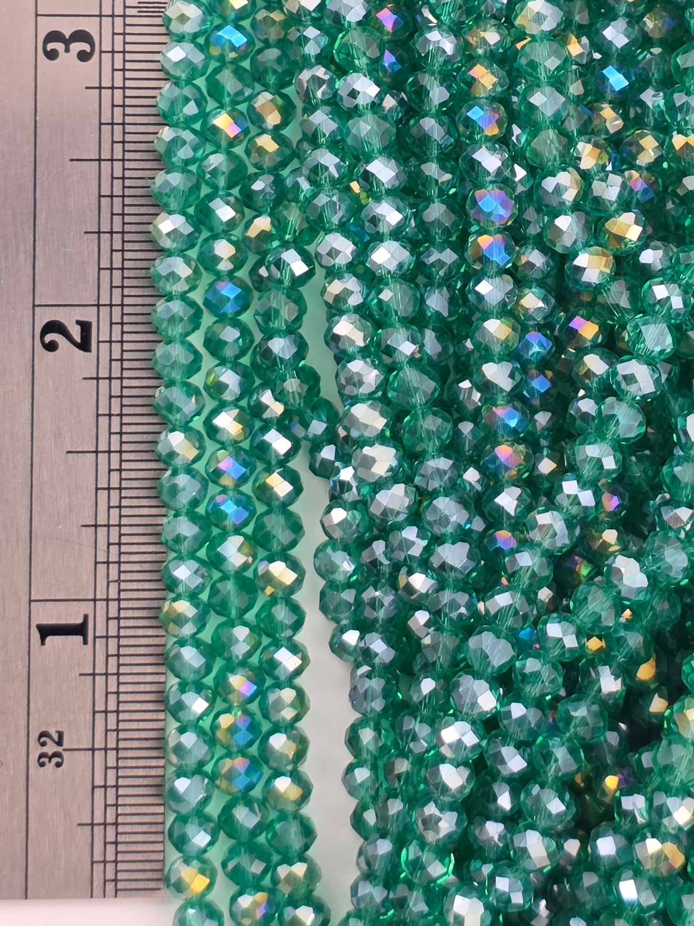 3x4mm - Crystal Rondelles - Emerald Green with Rainbow Luster