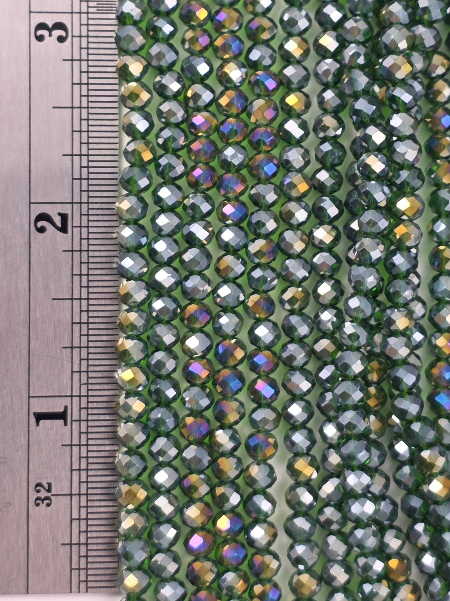 3x4mm - Crystal Rondelles - Dark Green Transparent with Rainbow Luster
