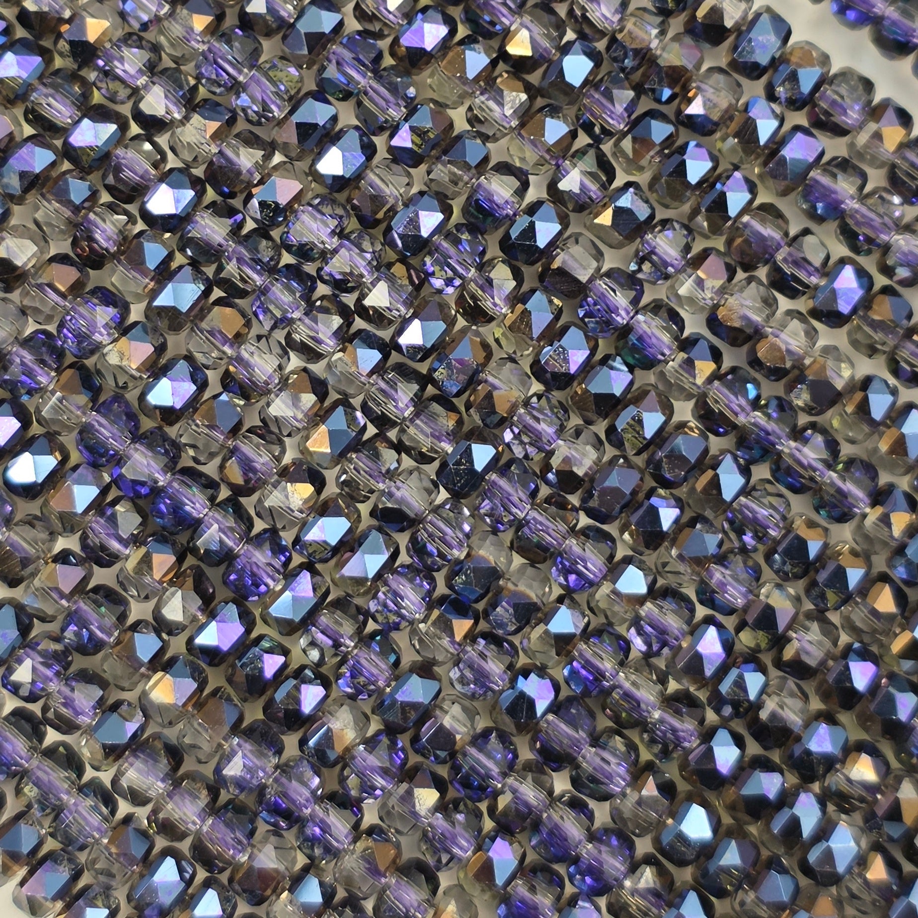 3x4mm - New Cut Crystal Rondelles - Black Diamond with Purple Luster
