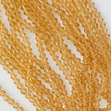 4mm Bicone - Light Topaz Transparent