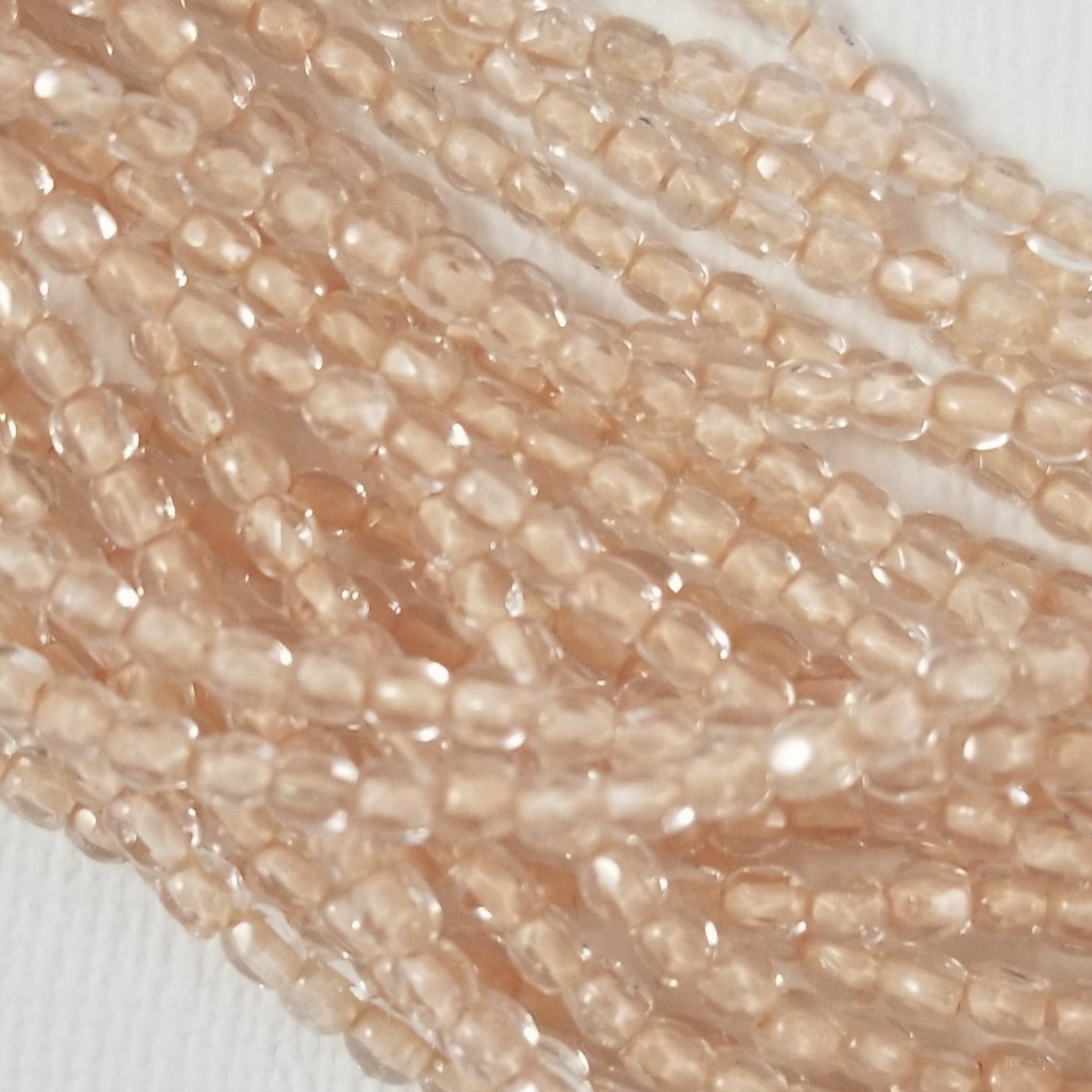 3mm - Pale Peachy Pink Lined Crystal - Fire Polished