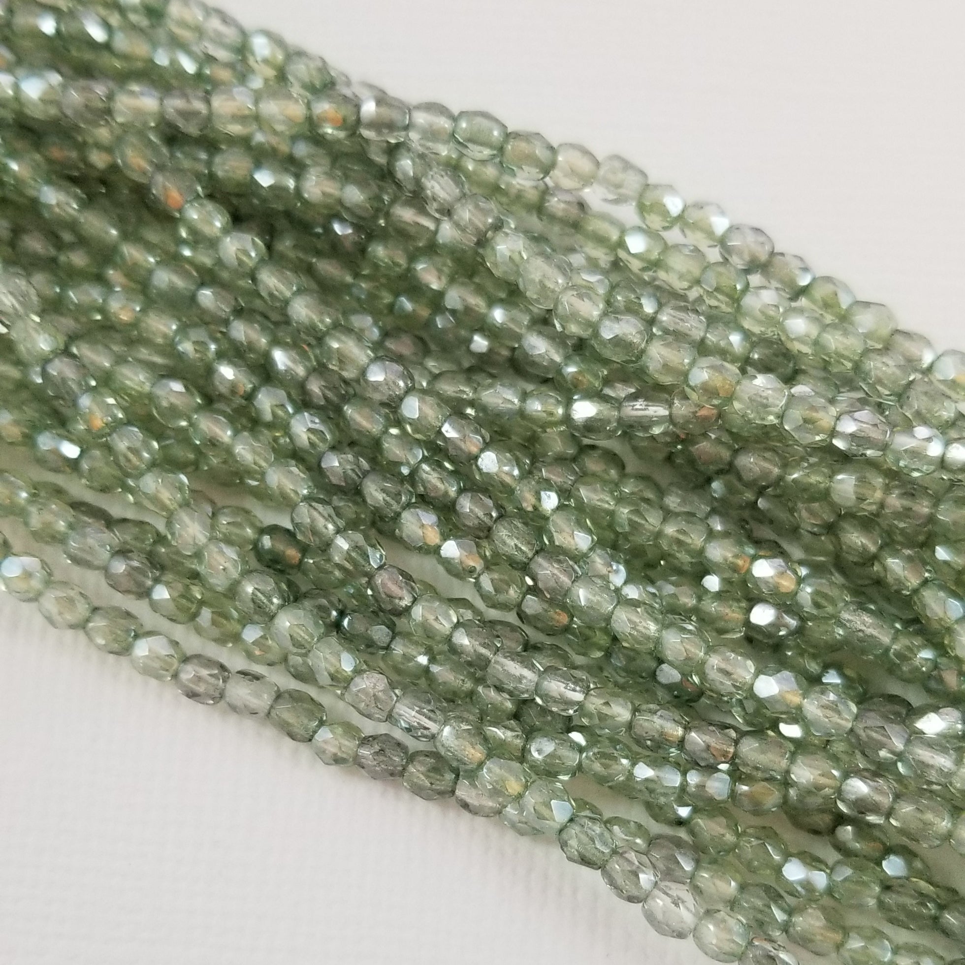 3mm - Crystal with Green Luster- Fire Polished